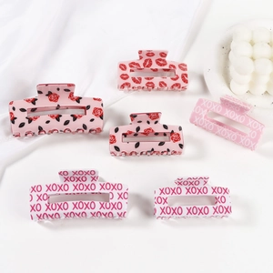 Pink Valentines claw clip set with XOXO rose and lip prints on white fabric