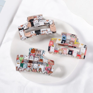 Three-piece set of cartoon animal print rectangle hair claws in a minimalist setup