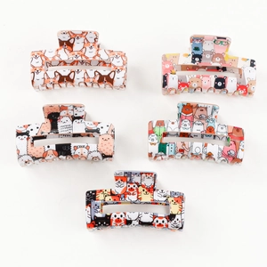 Set of five colorful cartoon animal hair claws featuring corgi and bear designs