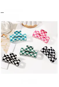 Detailed set of five rectangle checkered hair claws in blue, pink, green, and black colors