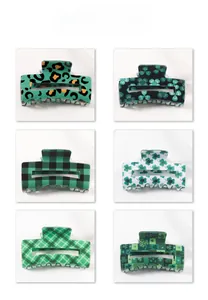 Detailed color display of six different clover and plaid patterns on hair claw clips
