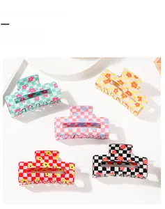 Set of five floral checkered hair claw clips in green, yellow, pink, red, and black
