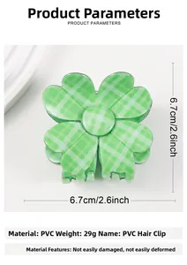 Macro detail of a 29g green checkered PVC four-leaf clover hair claw clip for women