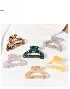 Collection of six large hollow acetate hair claw clips in various marbled candy colors