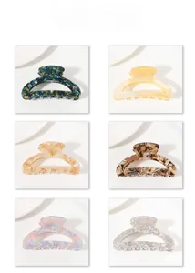 Collection of six different marble and solid color acetate hair claws in various styles