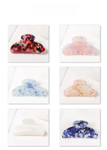 Detailed grid view showcasing six colorful acetate shark hair claw clips in various patterns