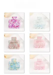 Six assorted colors and patterns of large square hair claws in a grid layout