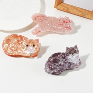 Cute cat-shaped acetate hair claws in pink, orange, and grey marble patterns