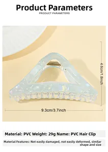 Detail view of light blue translucent triangle hair claw with dimensions and PVC material spec