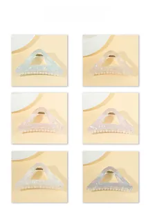 Detailed grid showing six hollow triangle hair claws in various iridescent colors