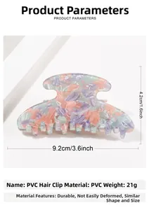 Detail view of colorful marble textured PVC hair claw with 9.2cm x 4.2cm dimensions