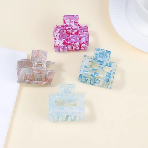 Set of 4 square hair claws in diverse patterns including marble and checkered acetate finishes