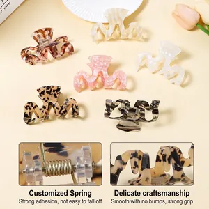 Large Korean-style hair claw clips in leopard and marble patterns with strong metal spring
