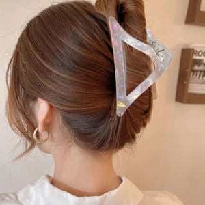 Iridescent triangle hair claw clip in pearly white finish shown on a ponytail