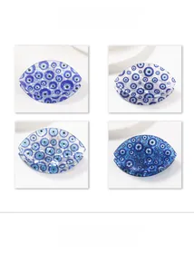 Detailed views of four blue acetate hair claws featuring the Mediterranean evil eye design