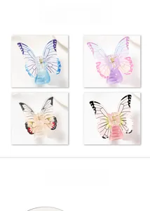 Detailed grid view of four different colored butterfly hair claws with acrylic finish