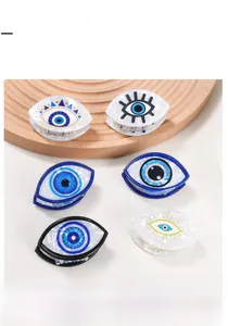 Detail-Set aus Acetat-Haarklammern mit bösem Blick in verschiedenen Blau- und Weißmustern