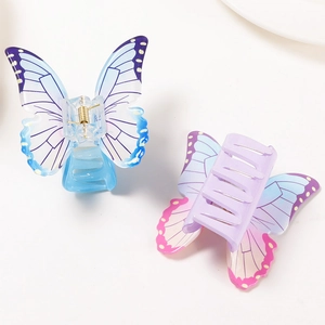 Elegant butterfly hair claw clips in blue and purple gradient acrylic with metal spring