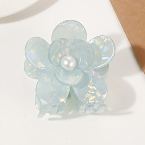 Iridescent light blue floral hair claw clip with a white center pearl for women