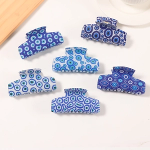 Blue evil eye pattern hair claw clips set in various shades of navy and turquoise