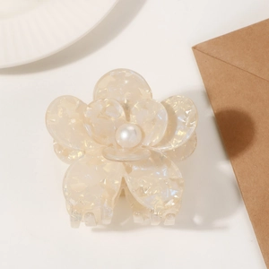 Creamy floral hair claw clip with pearl center and acetate marbled texture