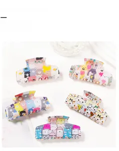 Detail showing assorted cartoon animal hair claw clips with bear and rabbit prints