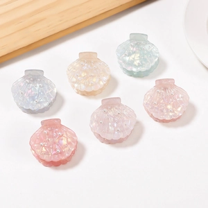 Set of six shell shaped hair clips with iridescent pearls in pastel colors