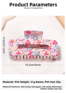 Pink PVC hair claw clip with colorful heart patterns measuring 10.2cm by 5.4cm size
