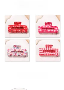 Detail of square hair claws with sweet heart patterns and checkered designs in four colors