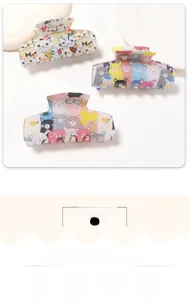 Close-up of three hair claws with cute cartoon cat and bear prints in high gloss finish
