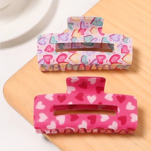 Square hollow hair claw clips with heart patterns in purple and pink acrylic finish