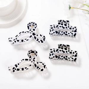 Set of 4 vintage cow print claw clips including bow and rectangular shapes for women
