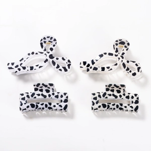 Chic 4-piece cow print hair claw clips set with butterfly and rectangular designs