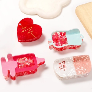 Cute medical theme hair claw clips featuring heart, drip, syringe, and pill designs