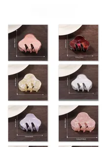 Detail view of acetate hair claws in six colors with size markings of 4.1cm and 5.6cm