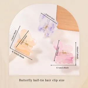 Trois pinces à cheveux papillon colorées avec texture marbrée et dimensions en cm et pouces