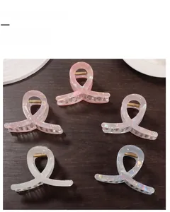 Set of five iridescent ribbon-shaped hair claw clips with gold metal springs