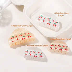 Elegant cherry pattern hair claw clip in cream and beige with glossy marble finish