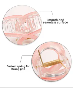 Detail of pink mermaid hair claw with strong gold spring and smooth matte finish