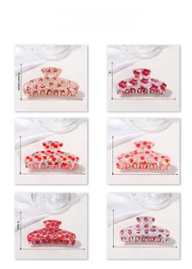 Vue détaillée des pinces à cheveux cerise et fraise de 9 cm avec dimensions