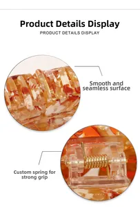 Detail of leaf hair claw clip with strong metal spring and smooth amber resin finish