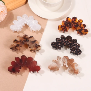 Set of six elegant French-style petal hair claws in assorted marble and tortoiseshell patterns
