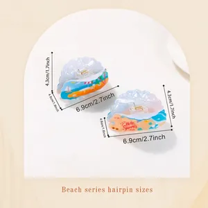 Summer shell-shaped hair claws with Hello Summer print in blue and beige tones