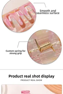 Detail of gradient marble hair claw clip showing smooth finish and strong metal spring
