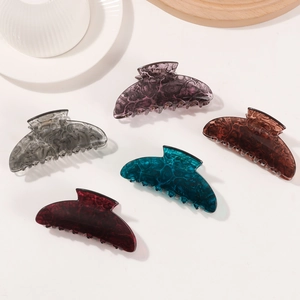 Five marble pattern acrylic claw clips in assorted colors for elegant hair styling