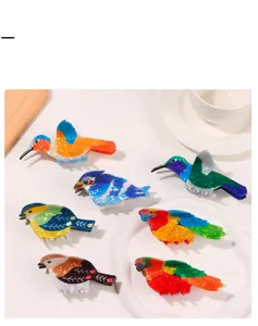 Detailed macro view of colorful acetate bird hair claw clips with pearlescent texture