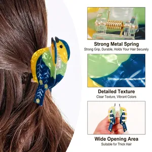 Colorful bird-shaped hair claw clip with marble texture and strong gold metal spring