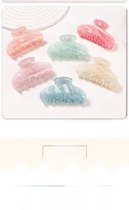 Macro view of macaron color hair claws with pearlescent marble texture and fine glitter
