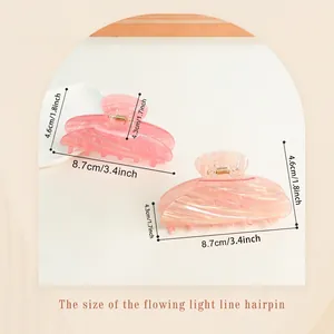 Gradient ribbon style shark hair claws in pink and light pink translucent finish