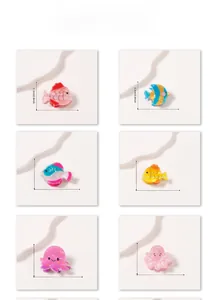 Detailed view of colorful ocean animal hair clips with specific size measurements in inches